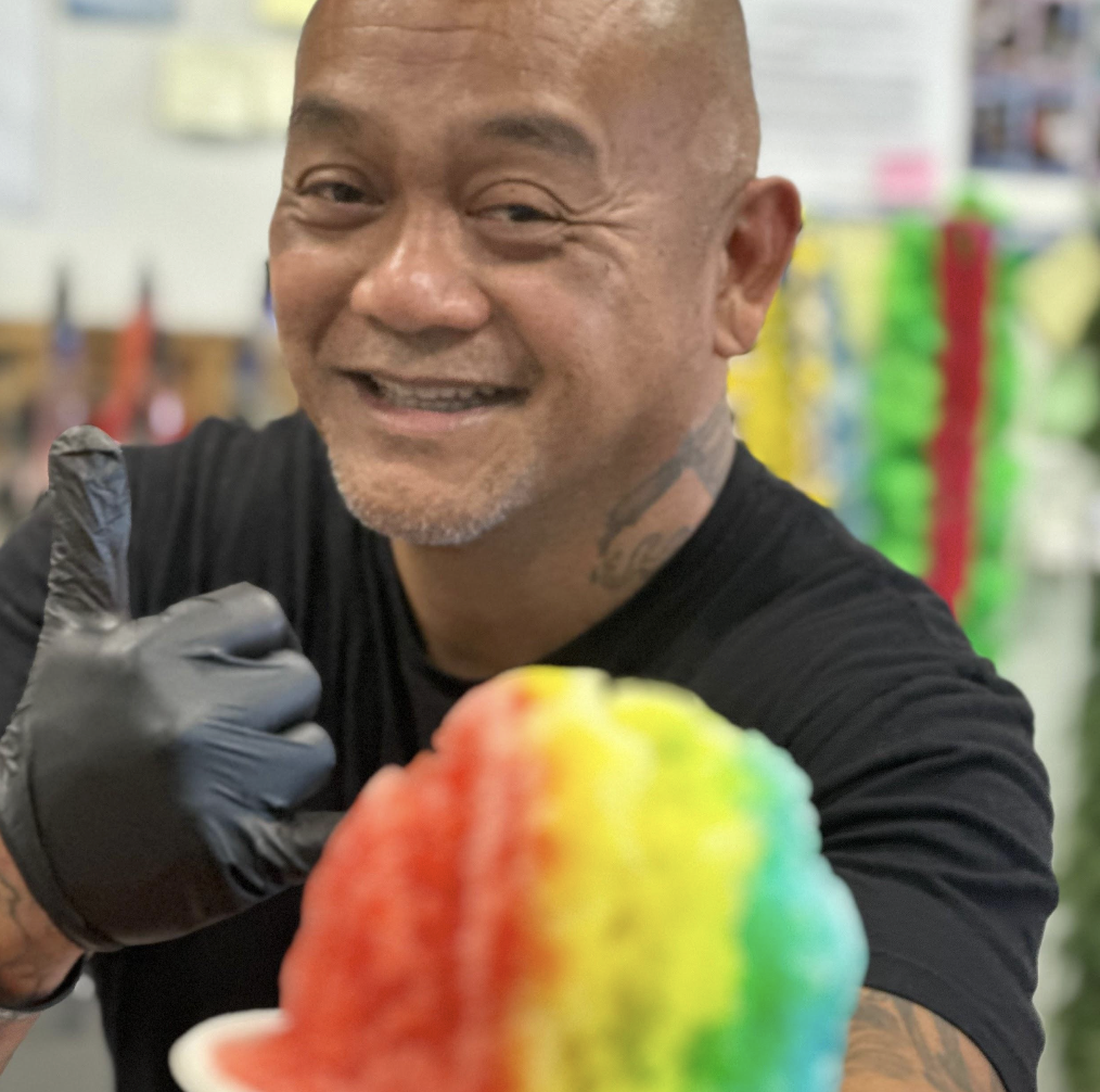 Eric Cabrera holding out a Hawalian shaved ice at PCH Shave Ice and Boba on Oct 2, 2024